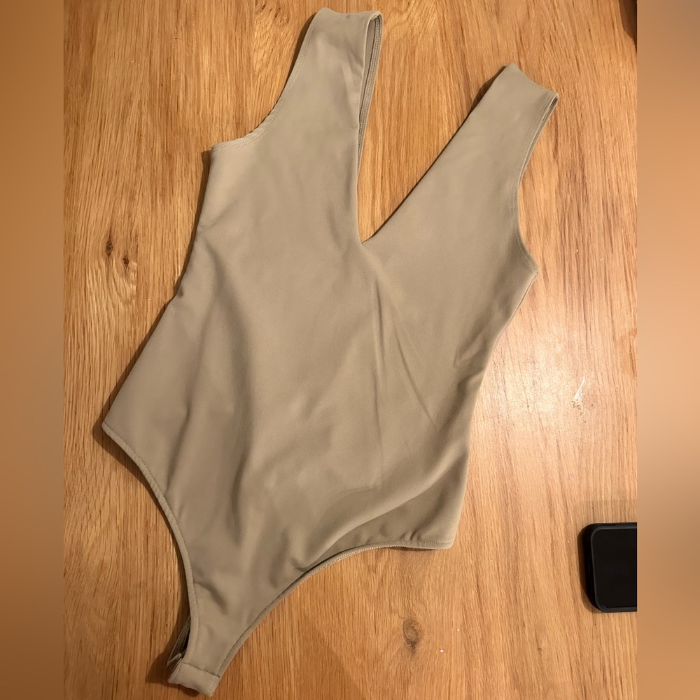 Free people tan / olive green V shape next. Bodysuit. Size small.